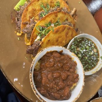 Mi Casa Taqueria signature dishes El Jefe Drunken Burrito
Oxtail Birria Tacos
Pork Belly Tacos